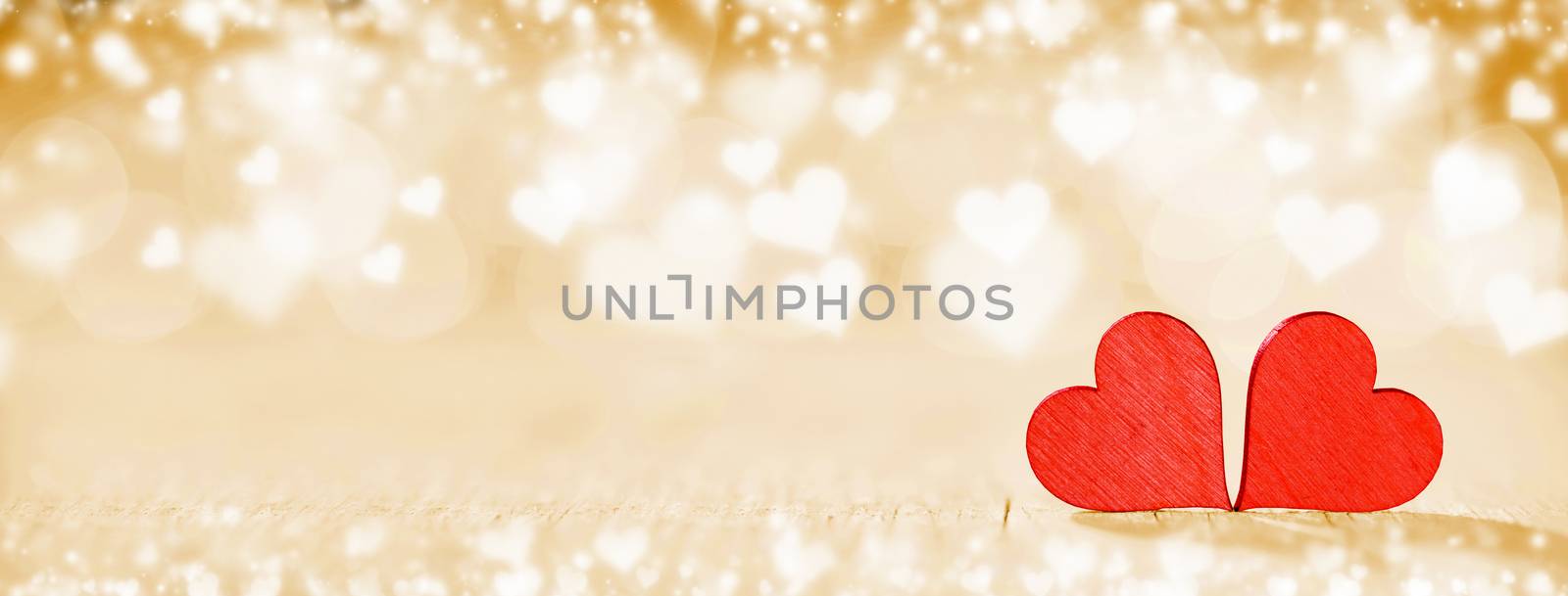 Two handmade wooden red hearts on beautiful bokeh background. Vintage style. Love Valentine's Day concept.