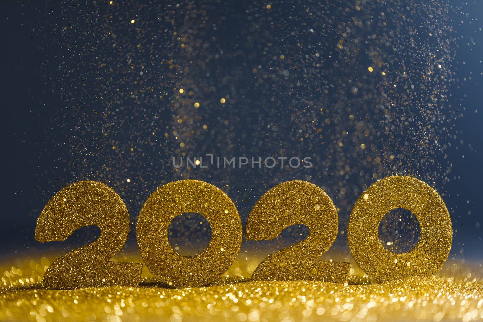 2020 New Year luxury design concept. Golden 2020 New Year horizontal template with golden glitter on blue backgound