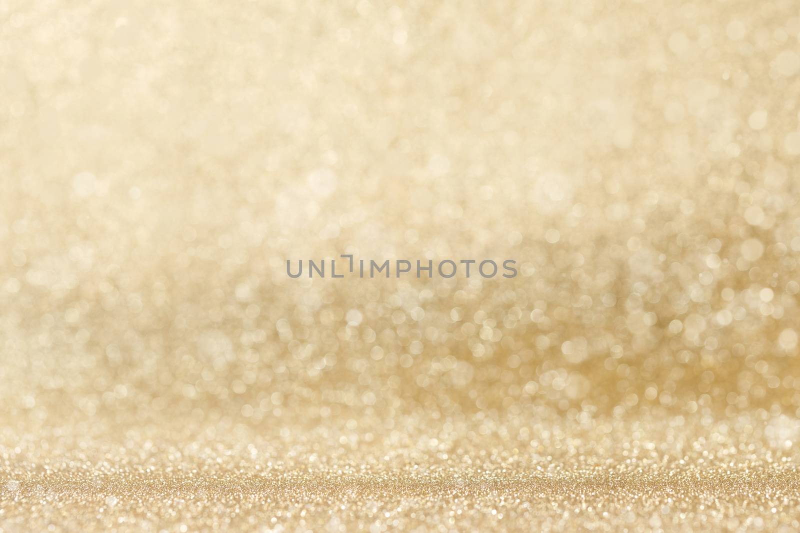 Shiny golden bokeh glitter lights abstract background, Christmas New Year party celebration concept