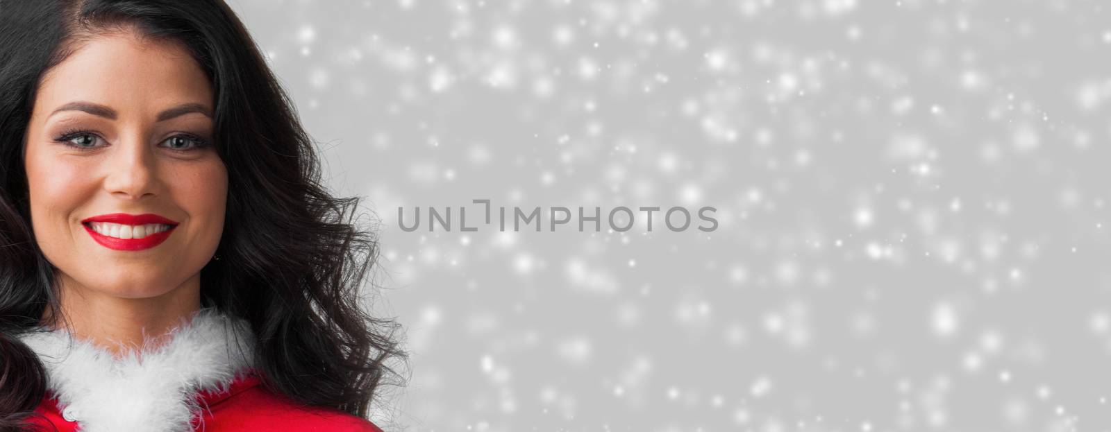Beautiful happy woman in Santa Claus clothes on glowing lights bokeh background