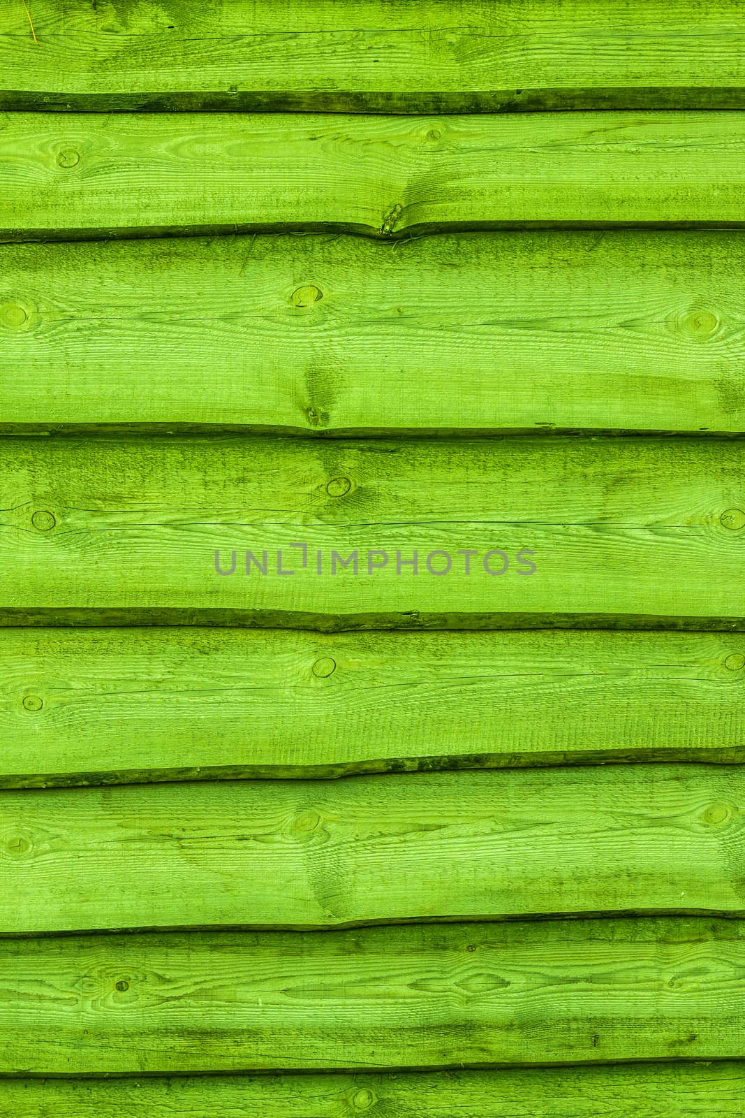 Green wooden boards vertical background. Wall floor or fence exterior design. Natural wood material backdrop