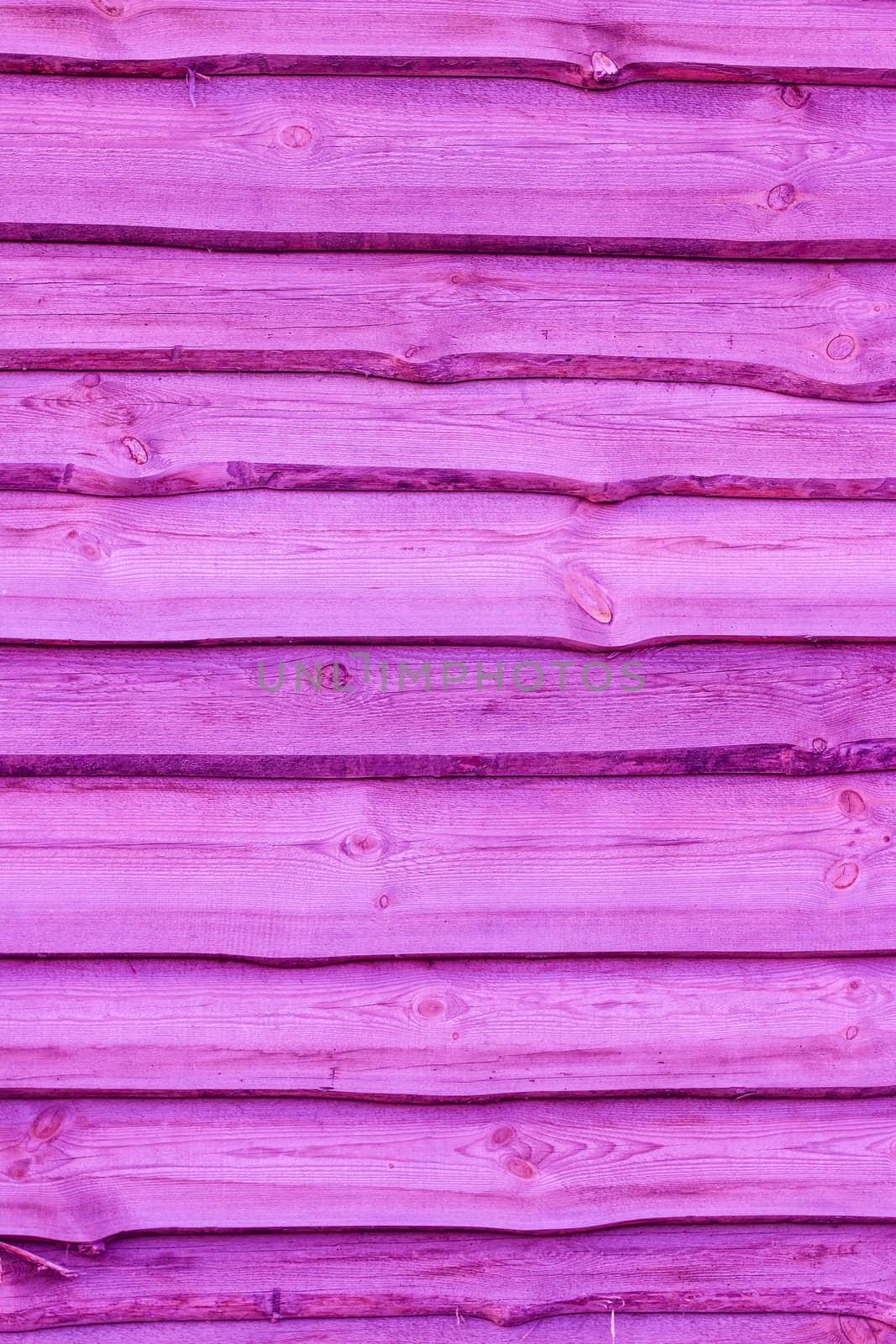 Pink wooden boards vertical background. Wall floor or fence exterior design. Natural wood material backdrop