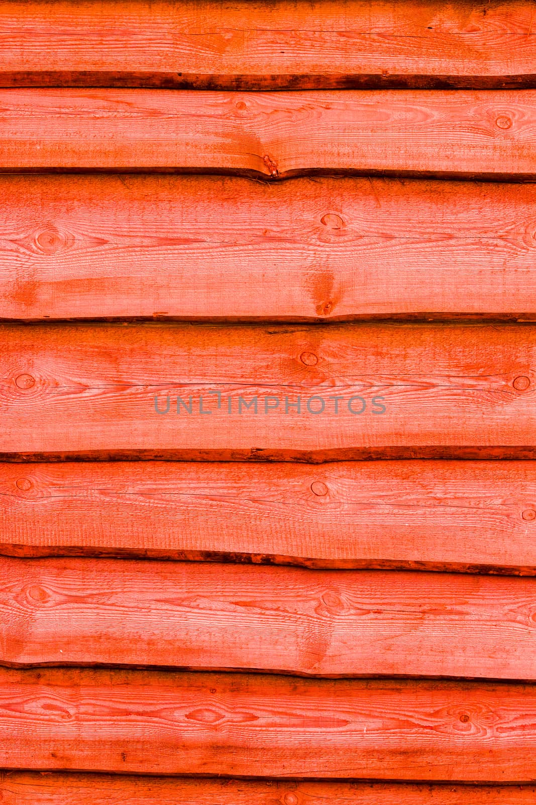 Red wooden boards vertical background. Wall floor or fence exterior design. Natural wood material backdrop