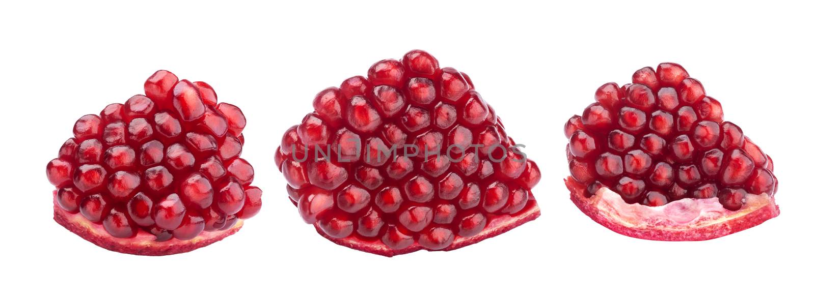 Ripe pomegranate segments isolated on white with clipping path