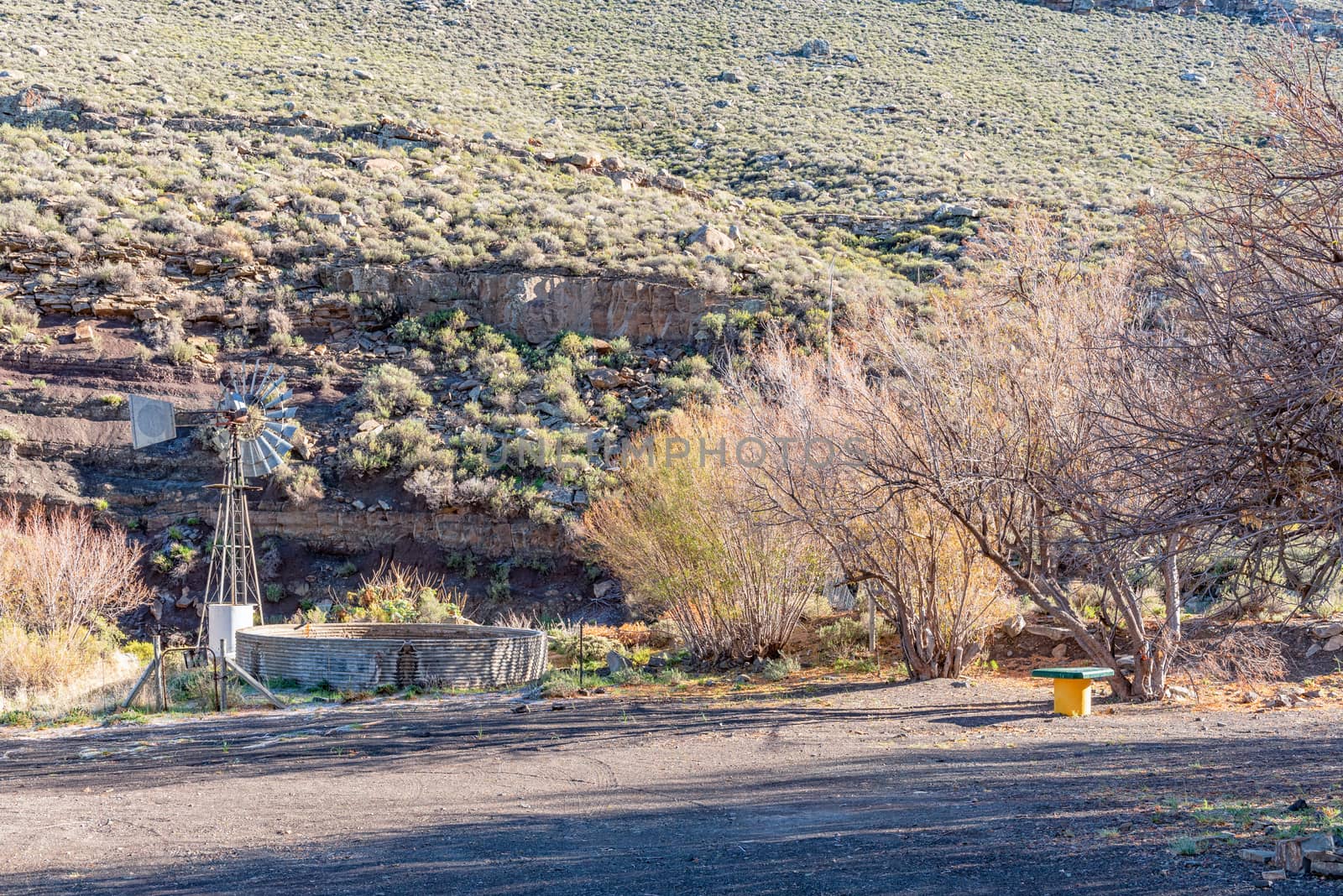 A picnic spot, with a windmill and dam, on the Verlatenkloof Pass on road R354 to the South of Sutherland in the Northern Cape Province