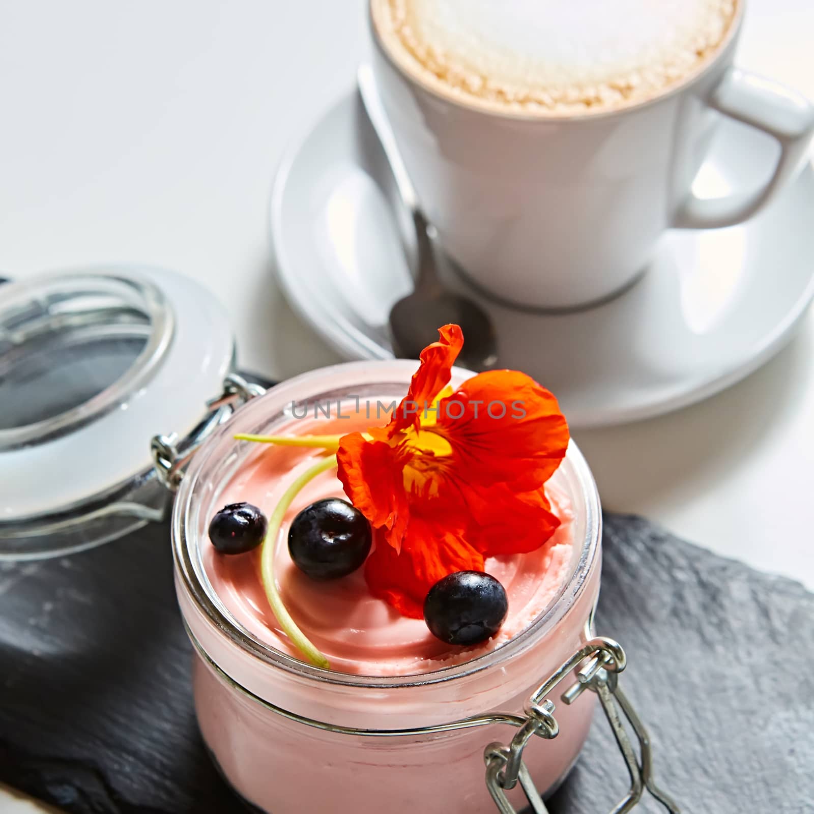 Fresh strawberry yoghurt dessert in glass, selective focus.