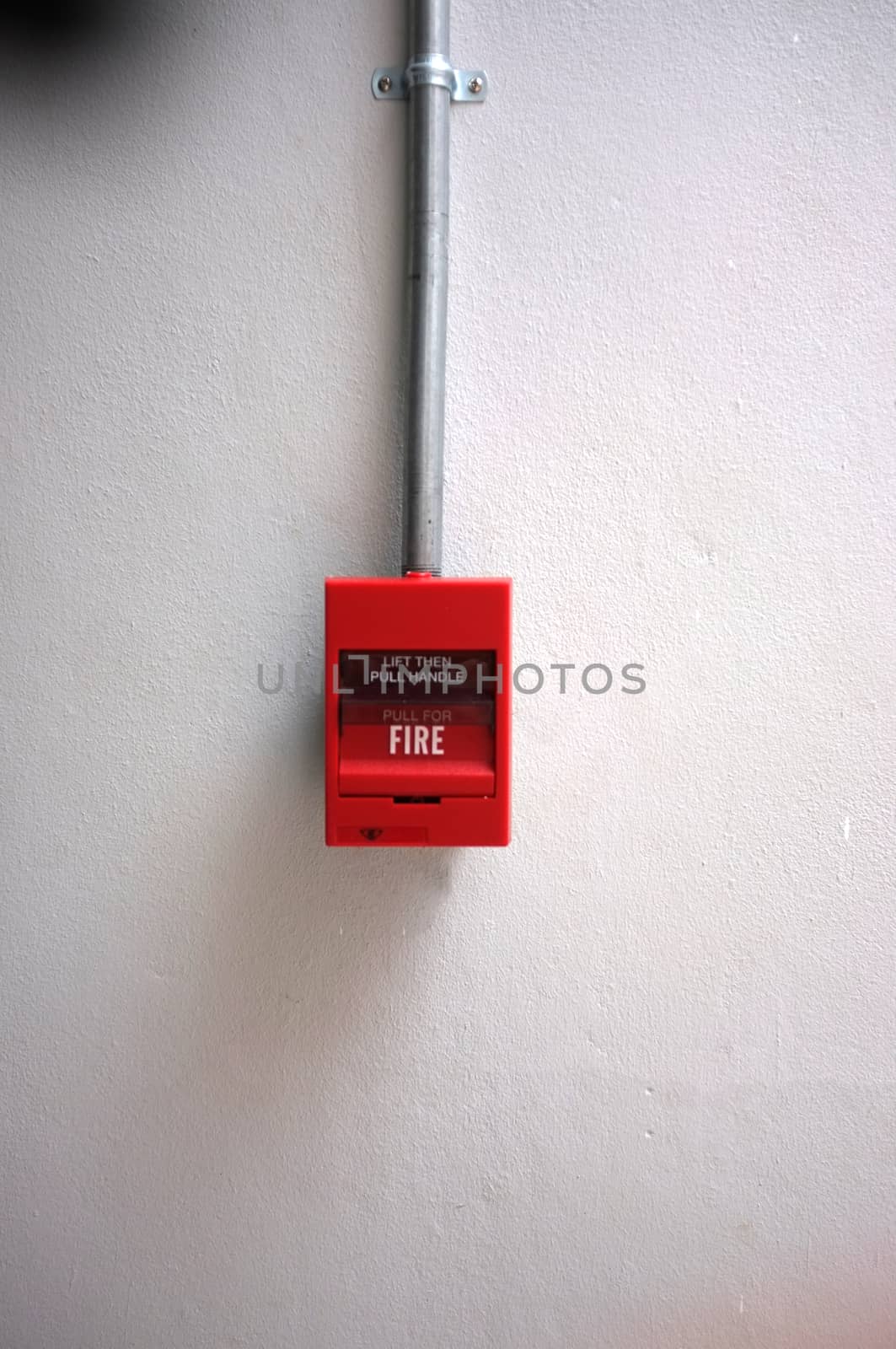 Fire alarm on the wall of shopping center.

