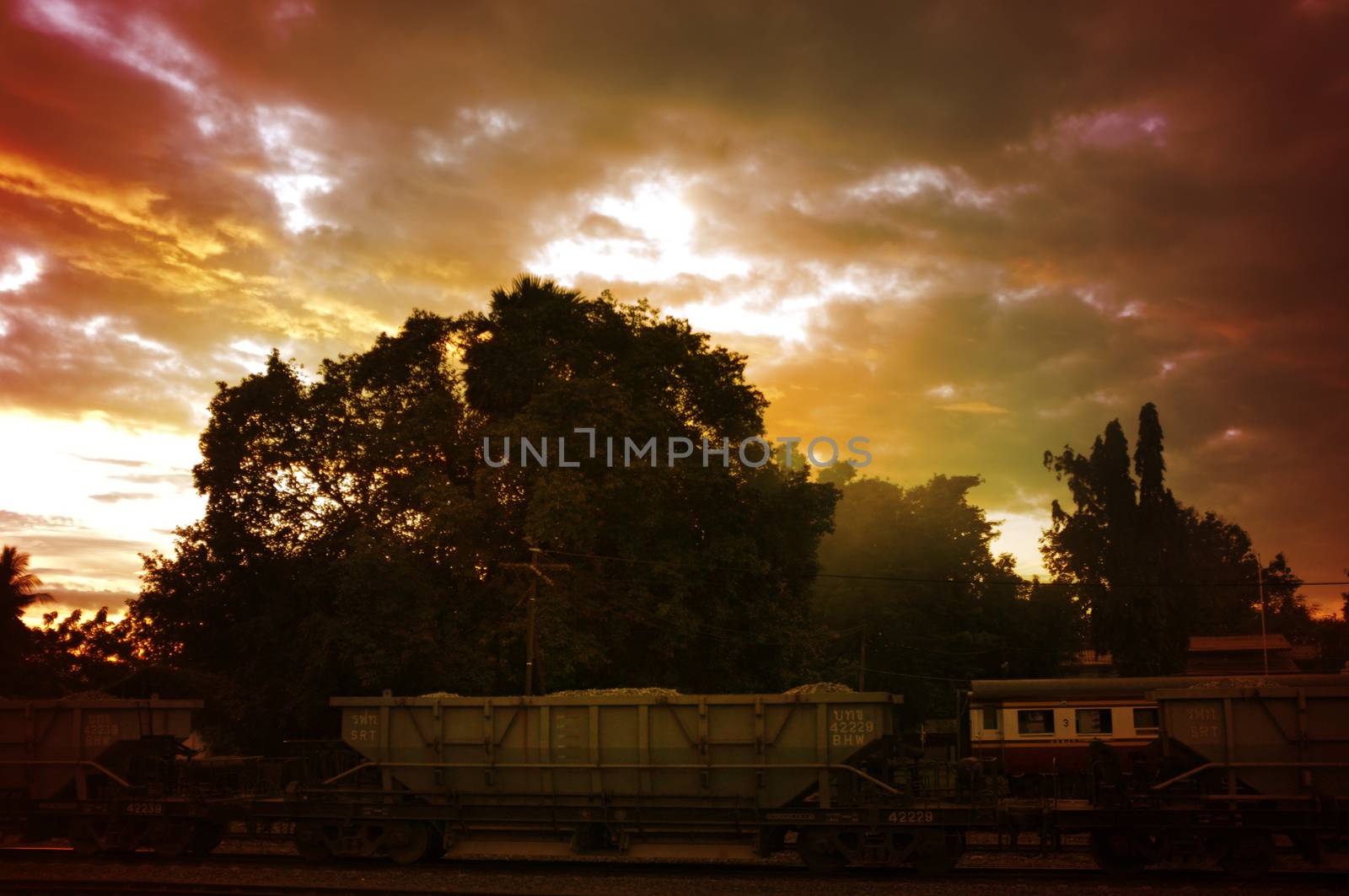 A colorful sunup above a small train station in thailand , Effect Golden light