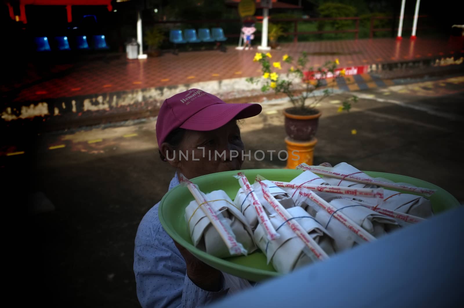 Phrae  , Thailand : September 13 2019 : The vendor on the Thai train sell Red pork noodles at Ban Pin Railway Station   by Hepjam