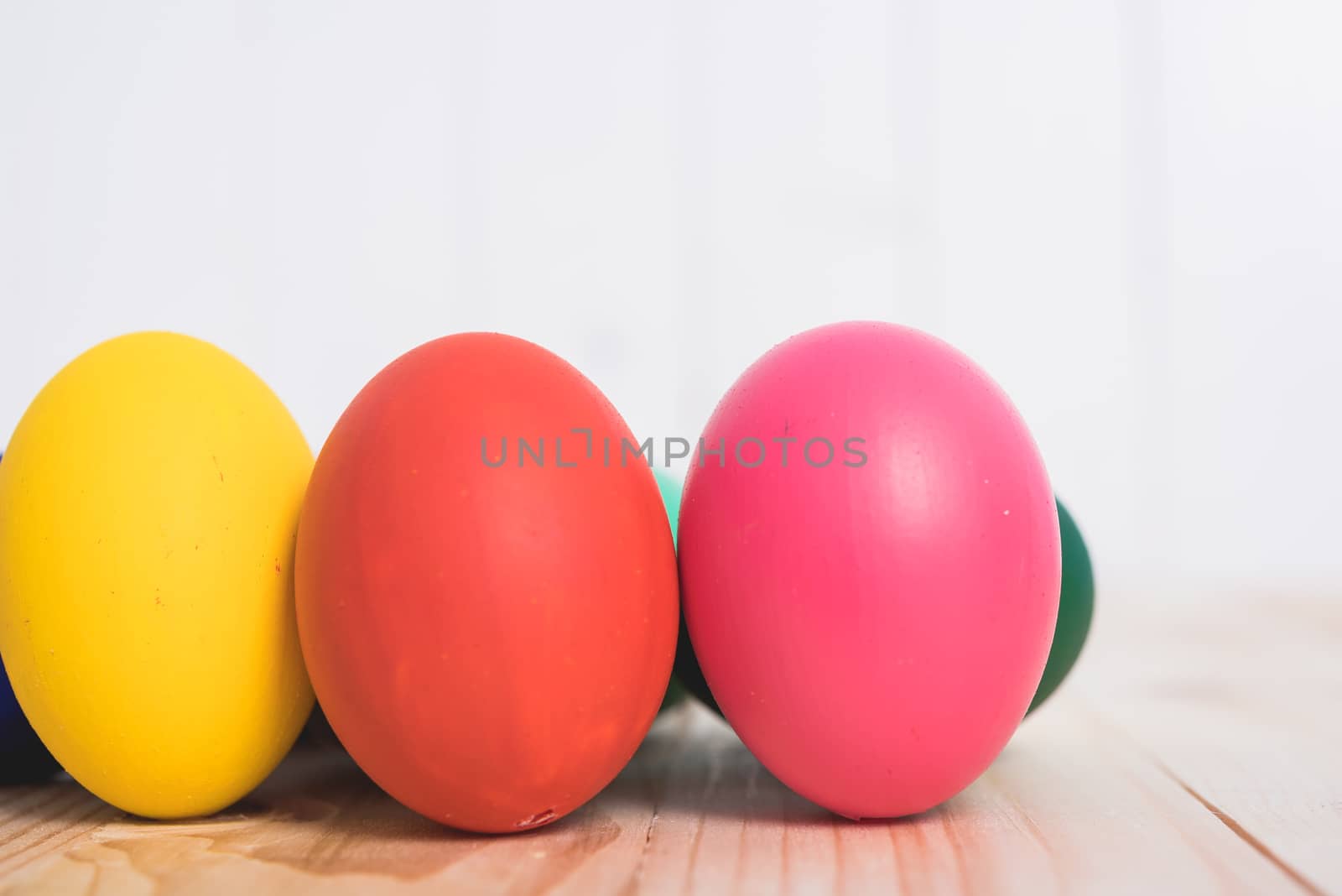 Easter eggs clean on wooden and white background, easter day concept