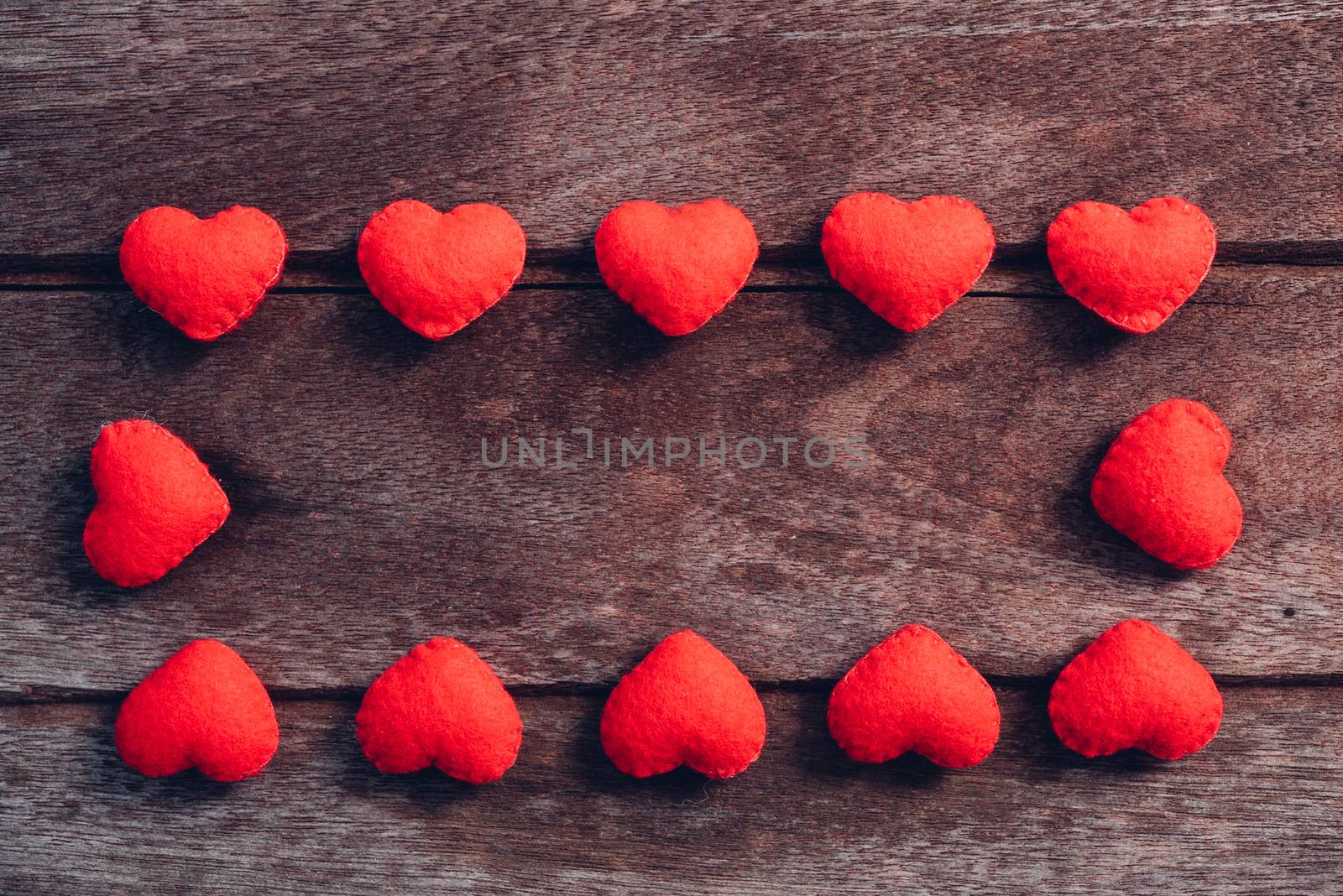 Fabric red heart on wooden background, valentine day concept