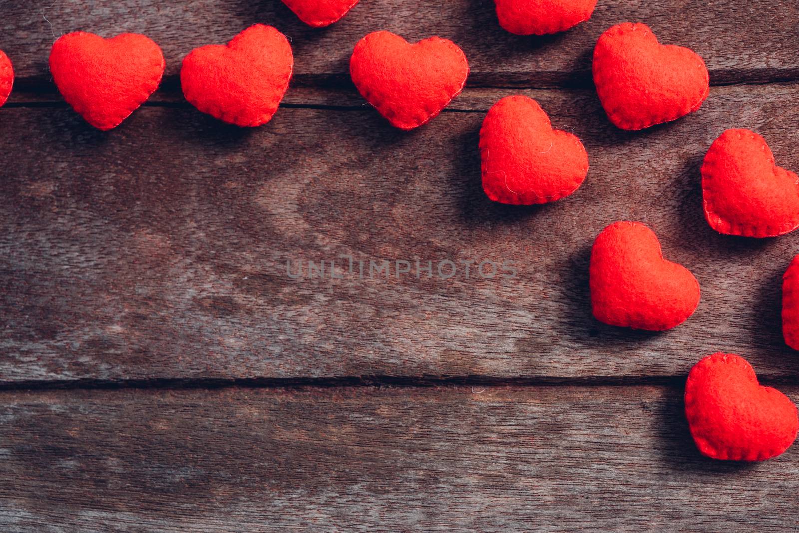 Fabric red heart on wooden background, valentine day concept