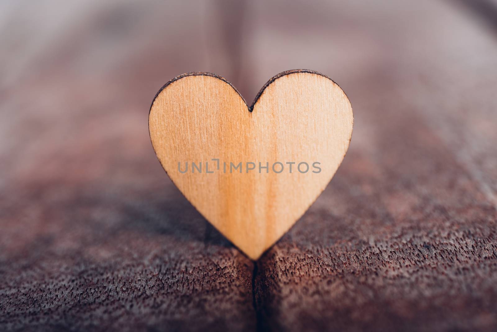 Wood heart stand on wooden background, valentine day concept