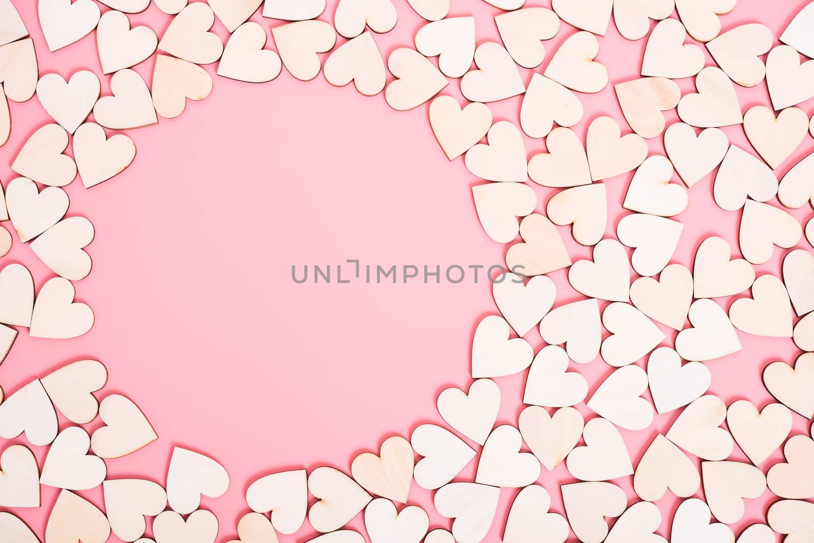 Wood hearts on pink background have sphere copy space, valentine day concept