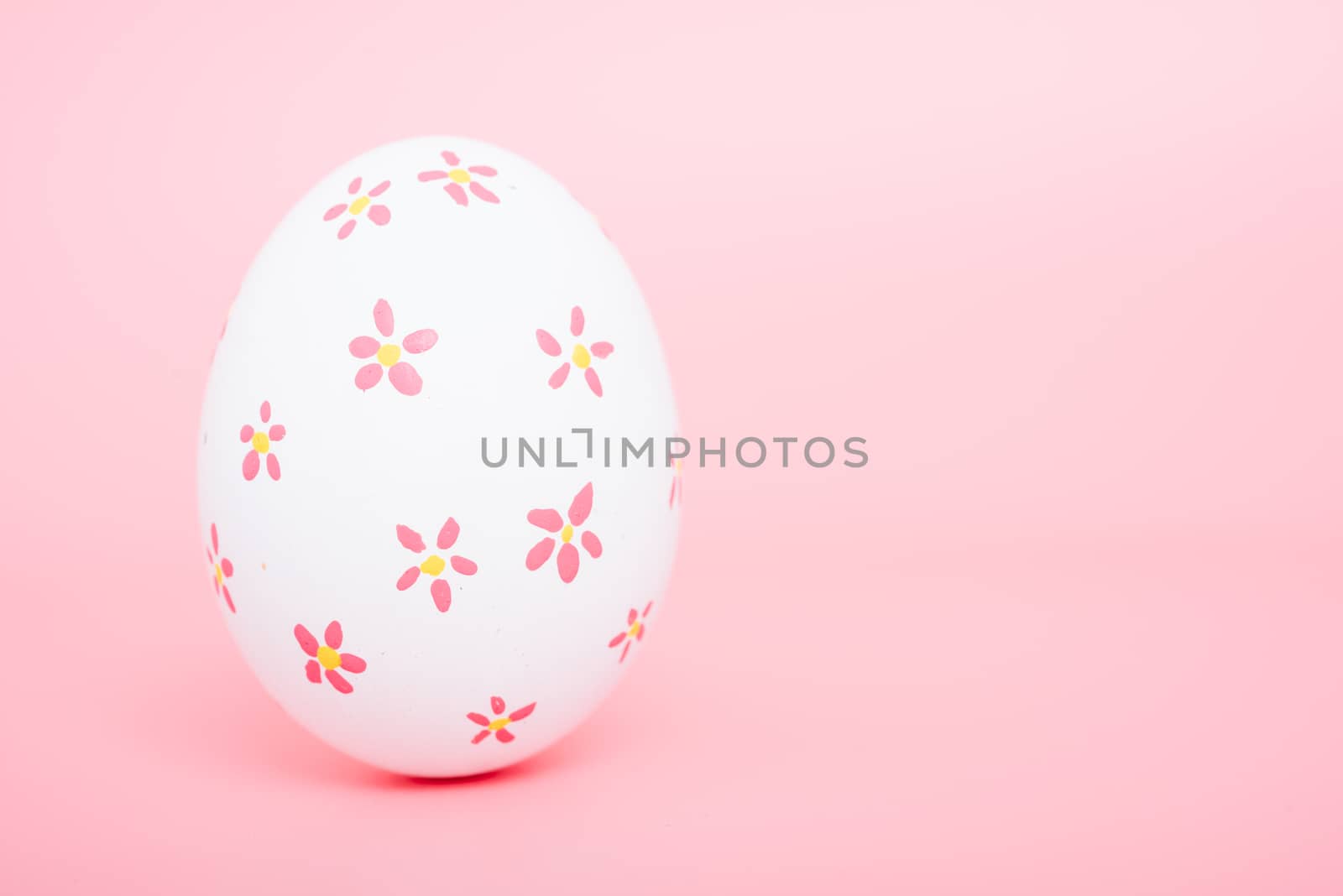 Beautiful Easter White egg color on pink background, Easter day concept
