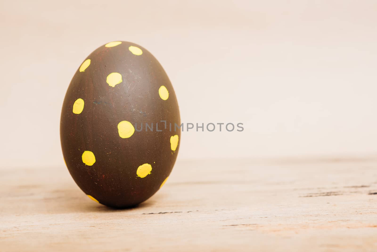 Beautiful Easter Brown egg on wooden background, Easter day concept