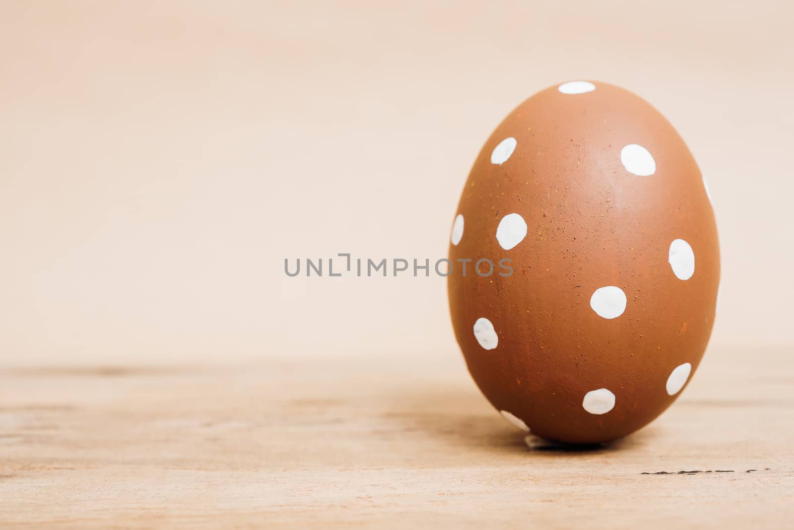 Beautiful Easter Brown egg on wooden background, Easter day concept
