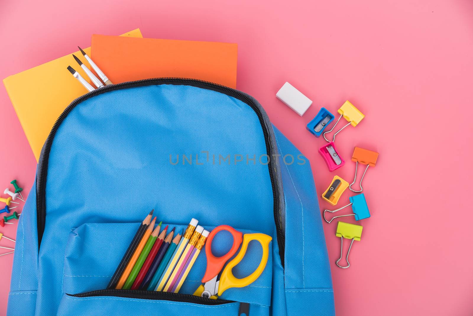 Blue bag backpack for education children on pink background back to school concept