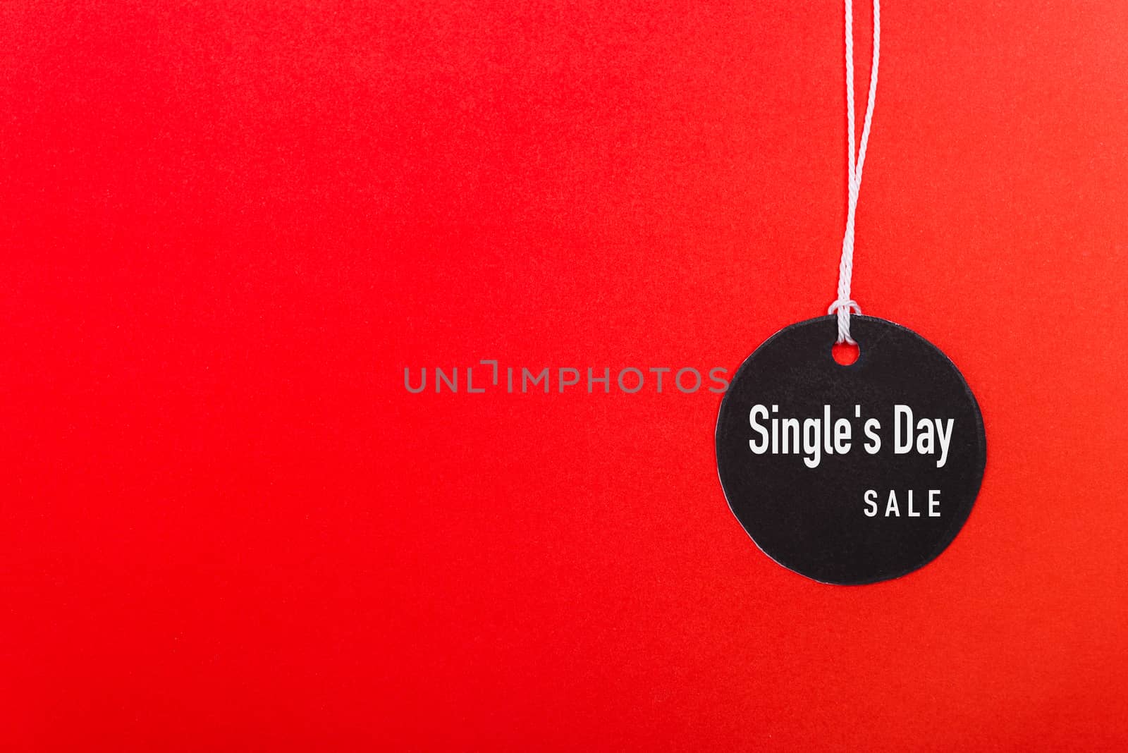 Online shopping Single's day sale text on Circle Black tag label on red background, with copy space