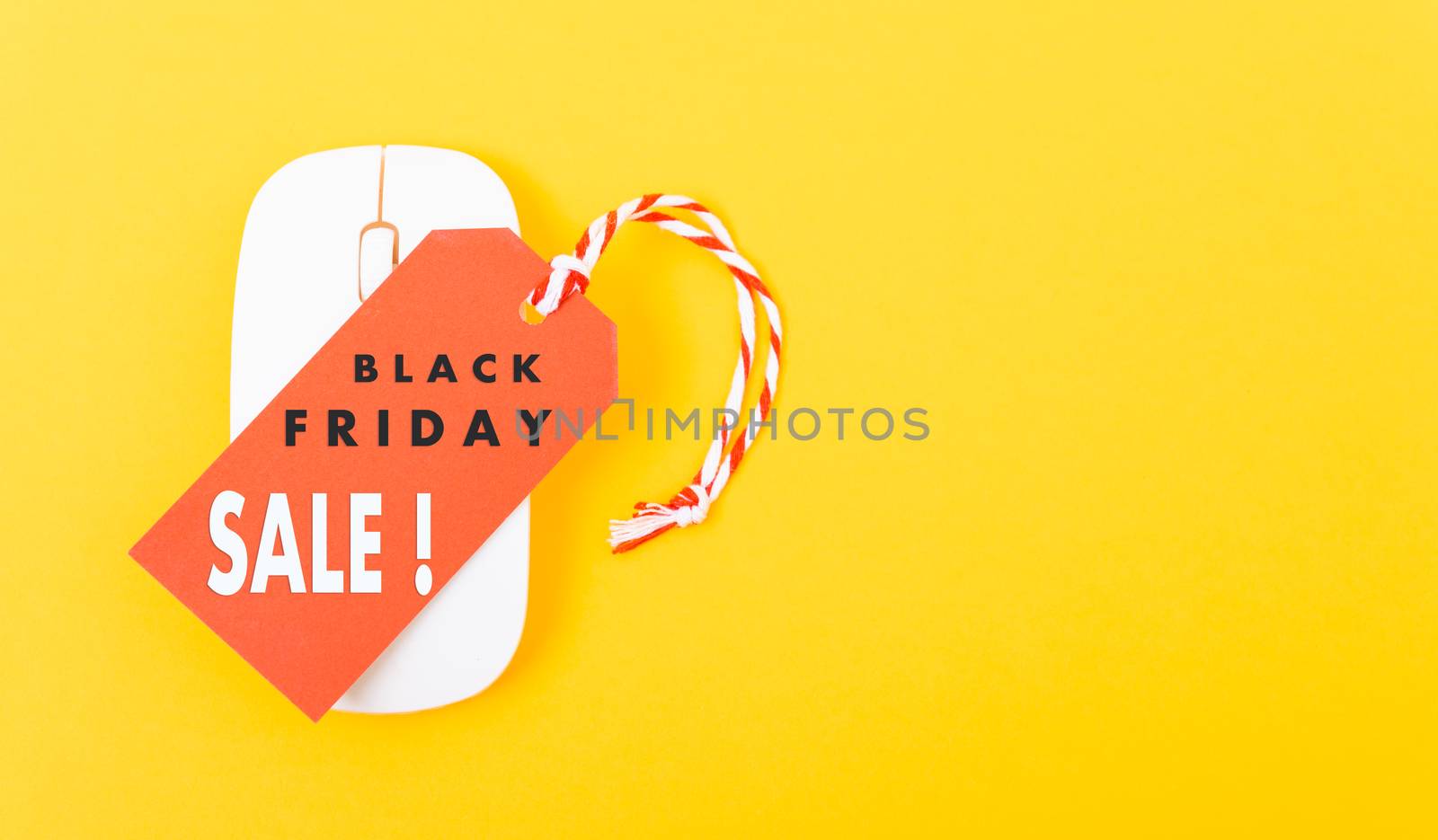 Internet online shopping marketing, Promotion Black Friday sale text on red tag label and white mouse with yellow background