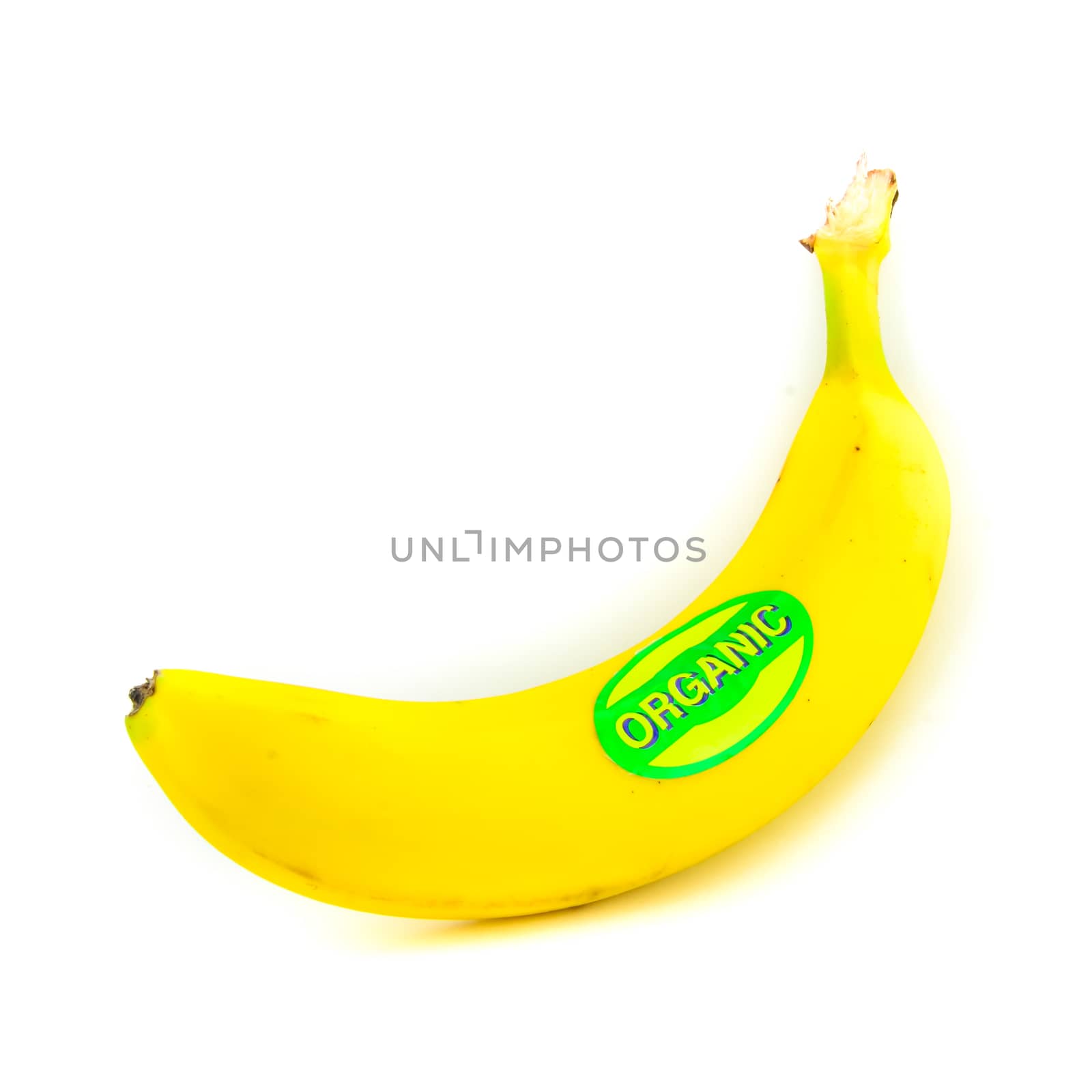 Studio shot organic labeled single whole banana isolated on white by trongnguyen