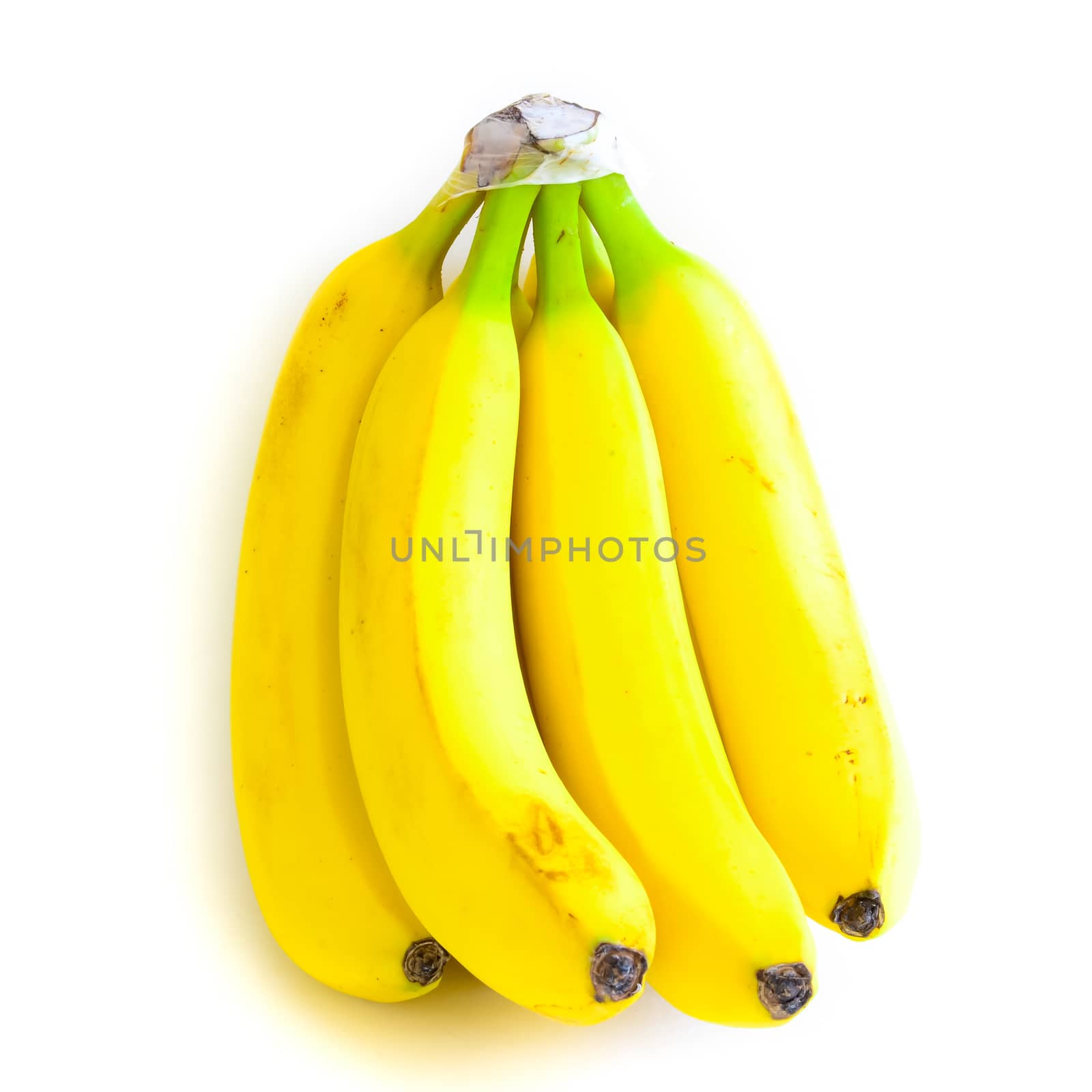 Bright yellow banana cluster isolated on white background. Bunch of organic fresh bananas with clipping path and copy space
