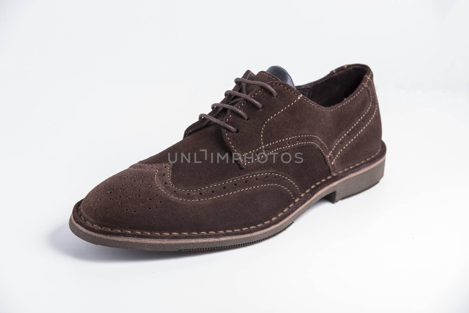 Male brown leather shoe on white background, isolated product, top view. by GeorgeVieiraSilva