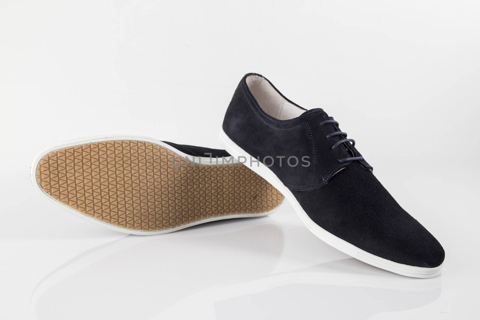 Male blue leather shoe on white background, isolated product.