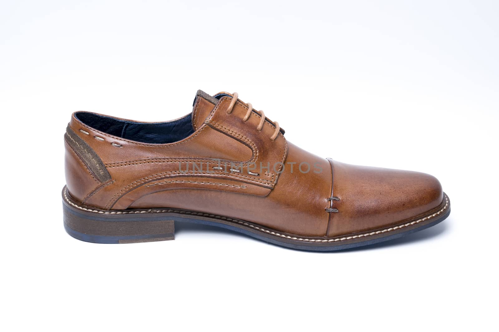 Male brown leather shoe on white background, isolated product, top view.