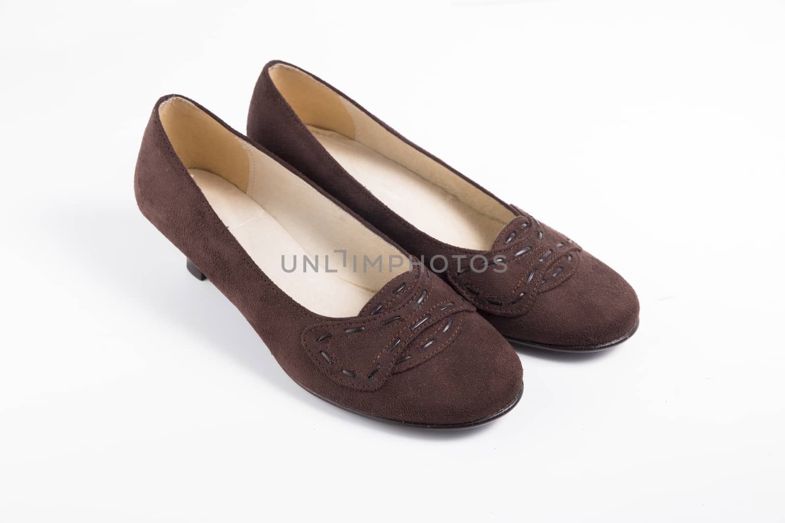 Pair of brown shoes on white background, isolated product.