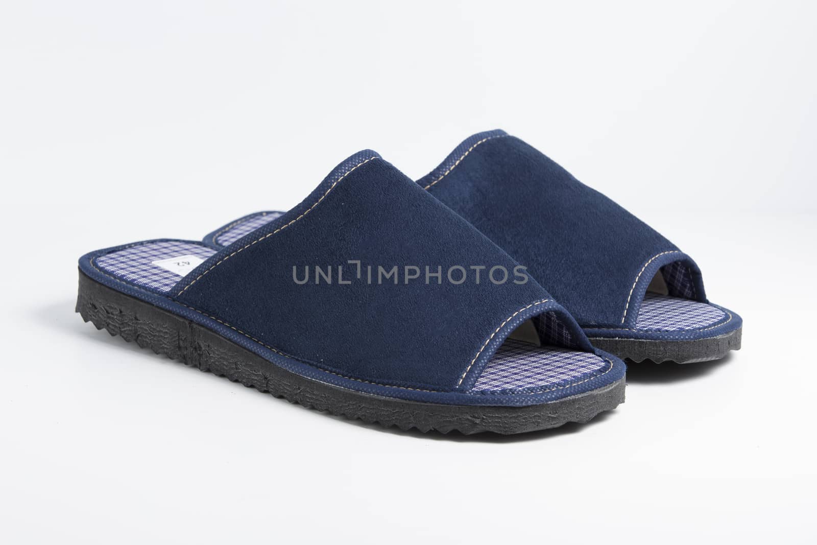 Male blue slipper on white background, isolated product.