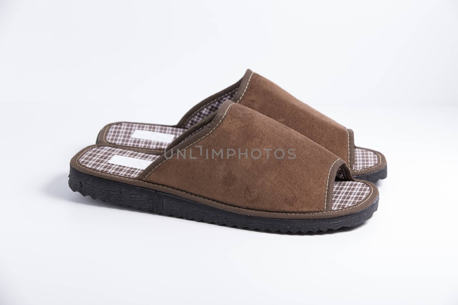 Male brown slipper on white background, isolated product.