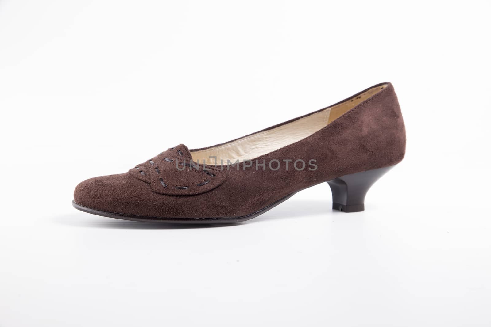 Female brown leather shoe on white background, isolated product. by GeorgeVieiraSilva