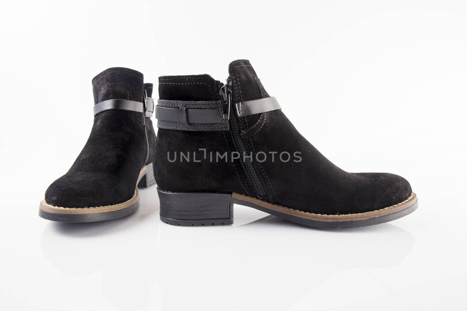 Pair of Female black boots on white background, isolated product.