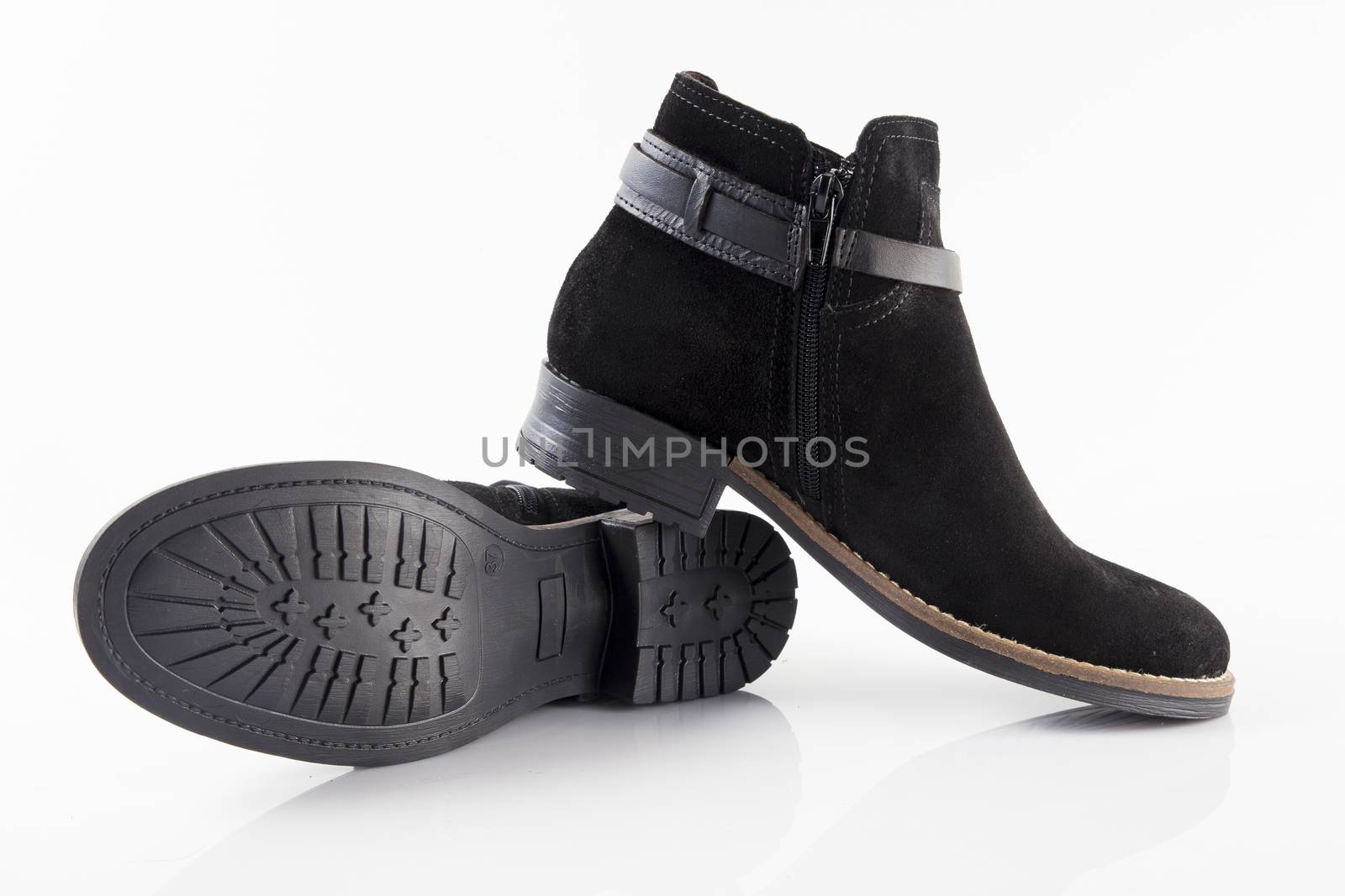 Pair of Female black boots on white background, isolated product.