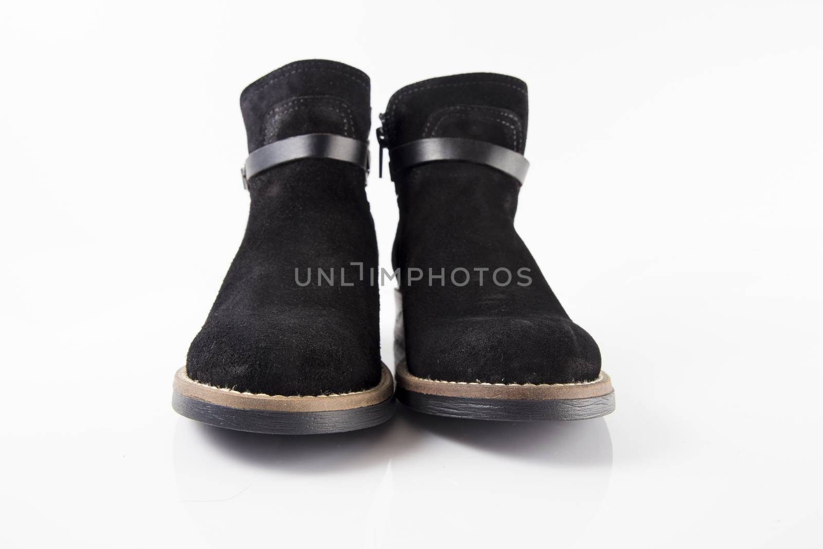 Pair of Female black boots on white background, isolated product.