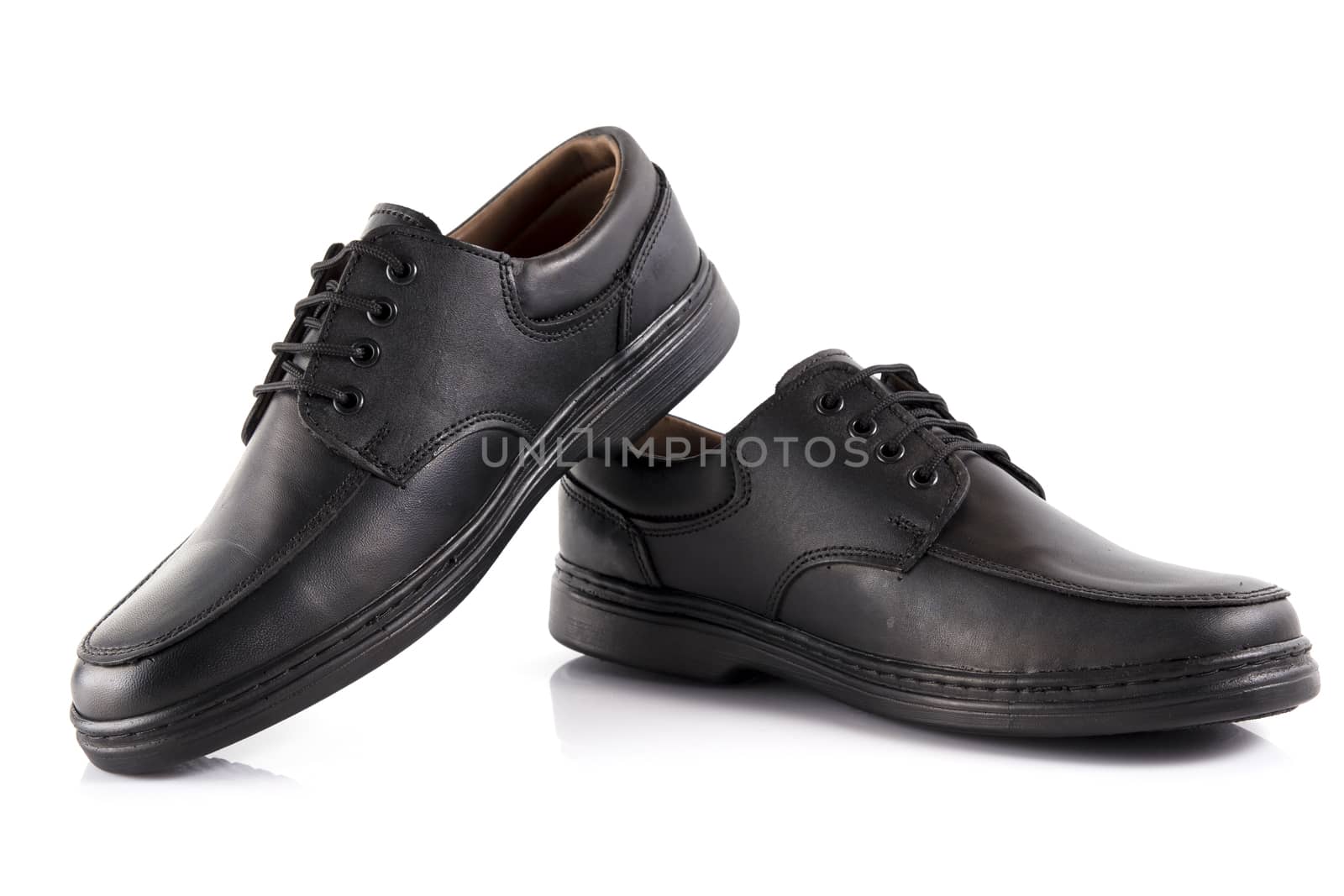 Pair of black leather shoes on white background, isolated product. by GeorgeVieiraSilva