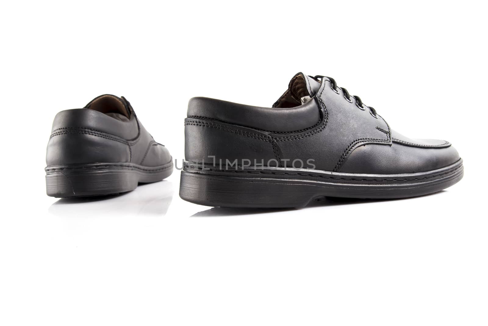 Pair of black leather shoes on white background, isolated product. by GeorgeVieiraSilva