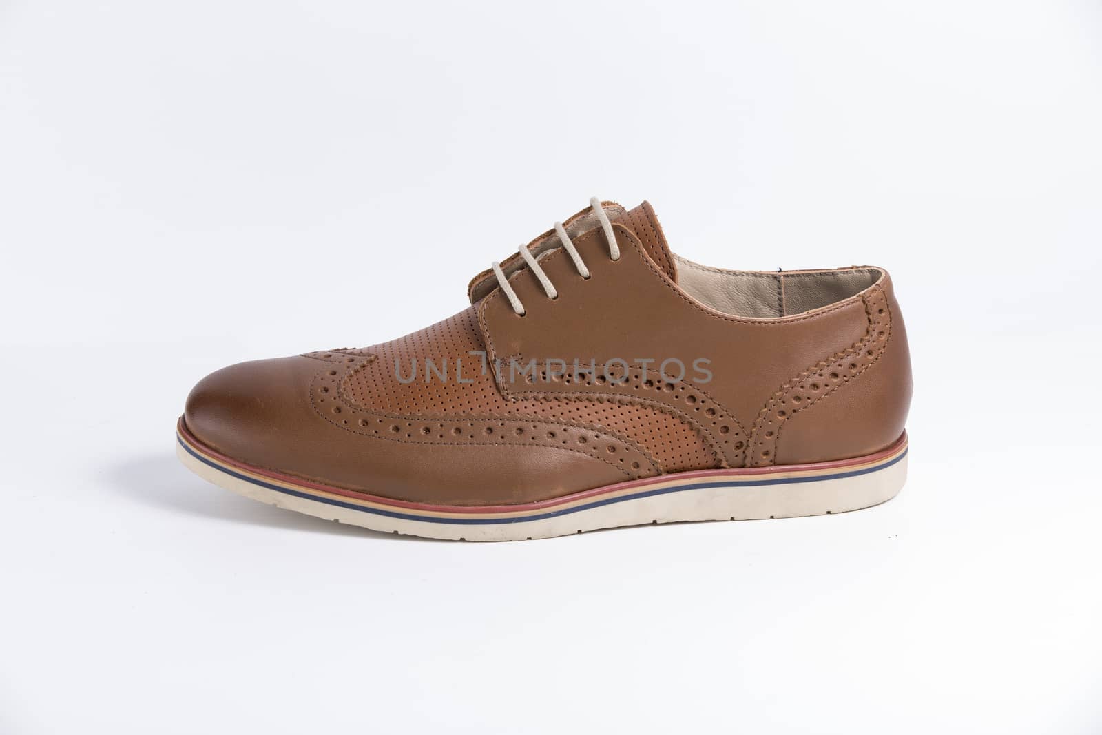 Male brown leather shoe on white background, isolated product. by GeorgeVieiraSilva