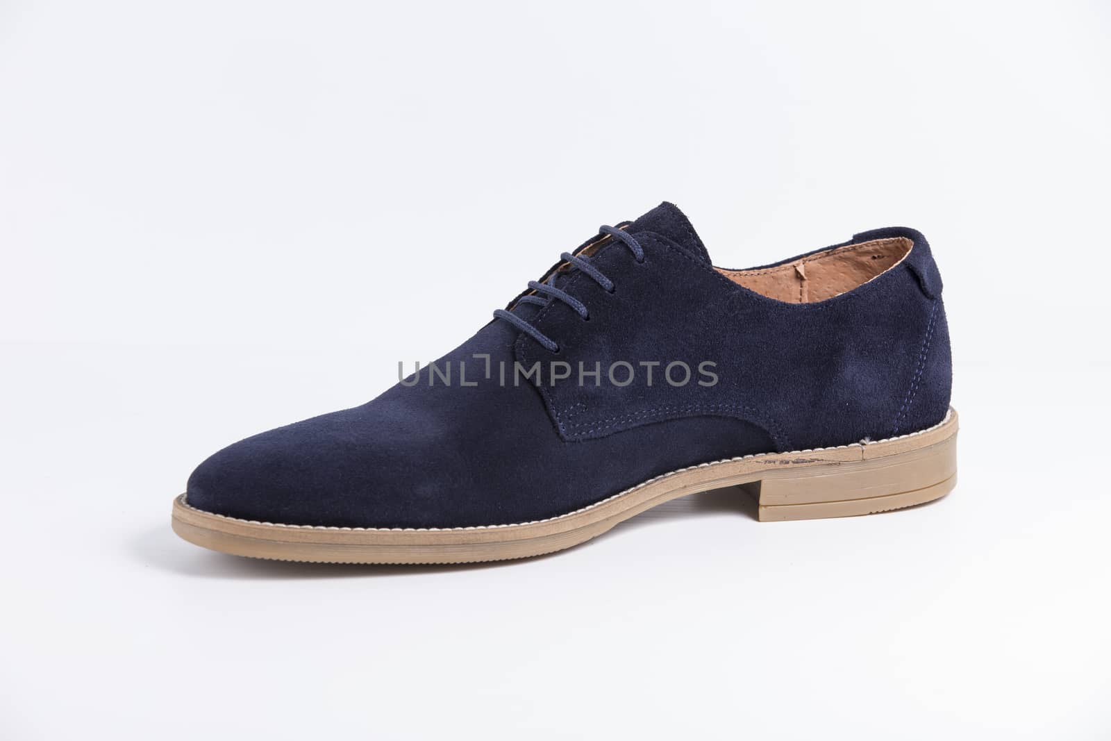 Male blue leather shoe on white background, isolated product.