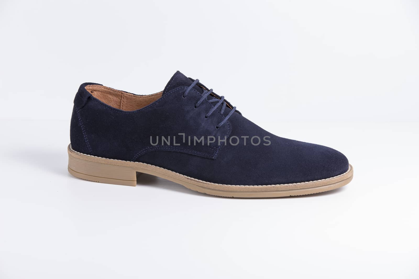 Male blue leather shoe on white background, isolated product.