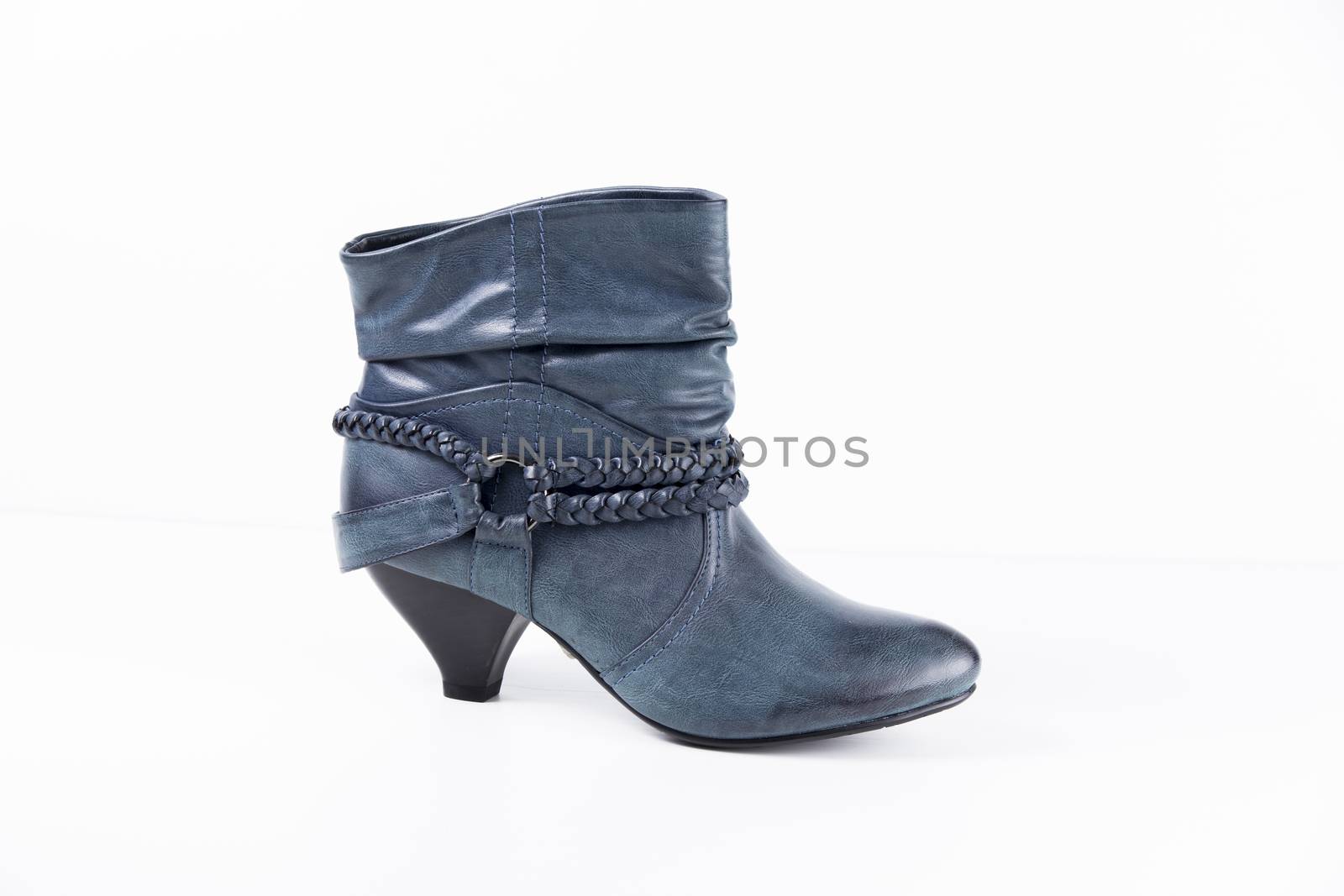 Female blue leather boots on white background, isolated product.