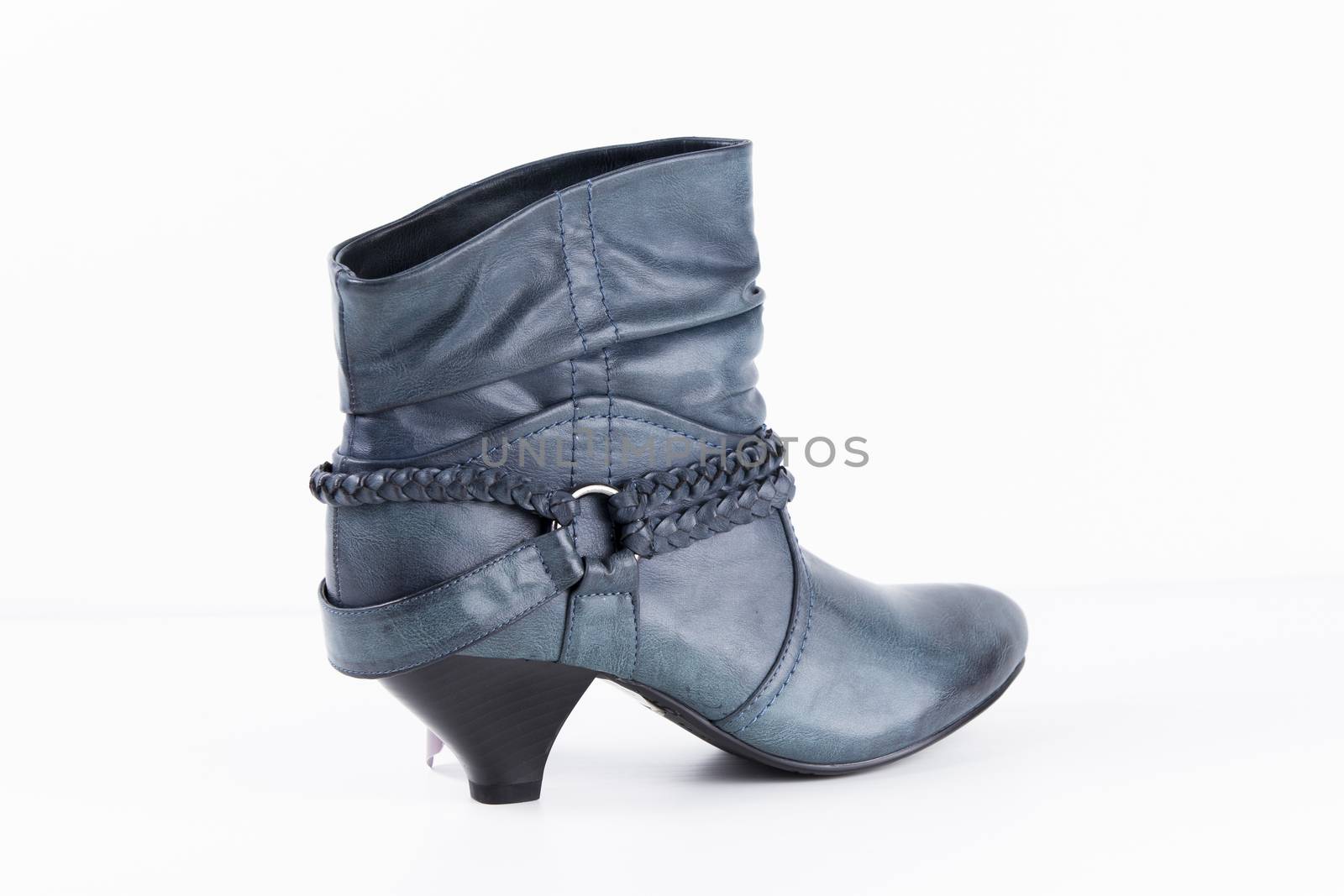 Female blue leather boots on white background, isolated product. by GeorgeVieiraSilva