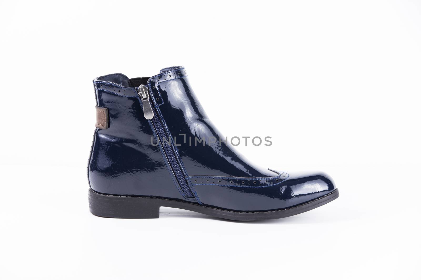 Female blue leather boots on white background, isolated product.