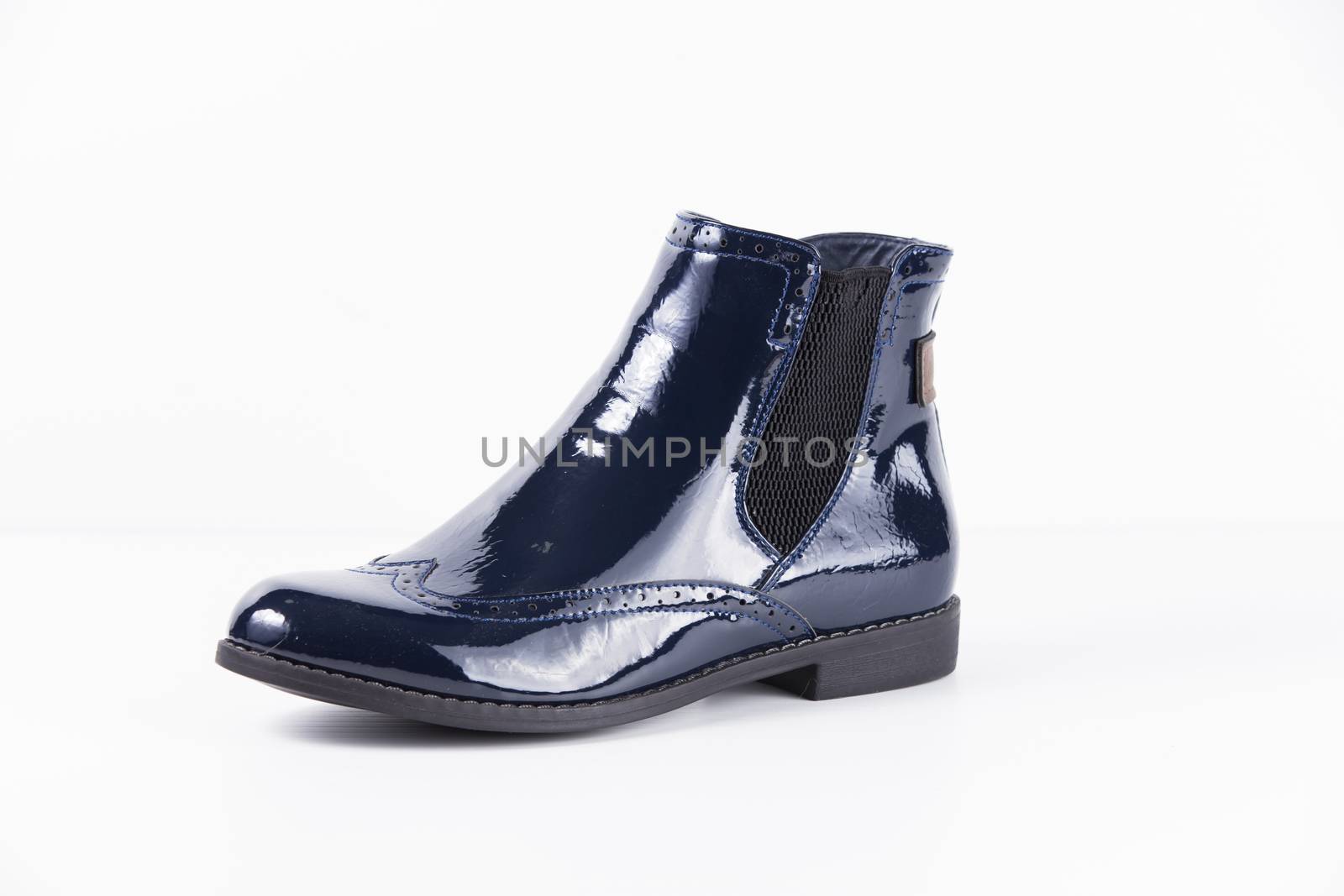 Female blue leather boots on white background, isolated product. by GeorgeVieiraSilva