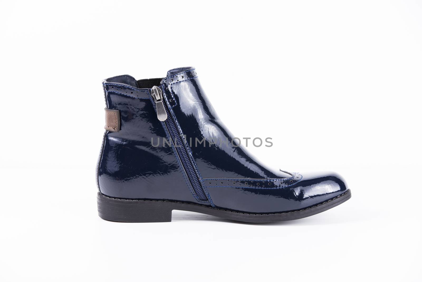 Female blue leather boots on white background, isolated product.