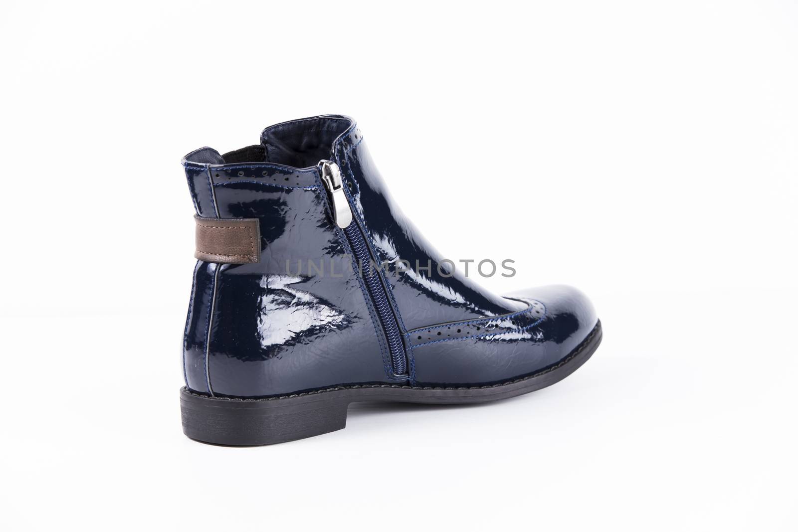 Female blue leather boots on white background, isolated product. by GeorgeVieiraSilva