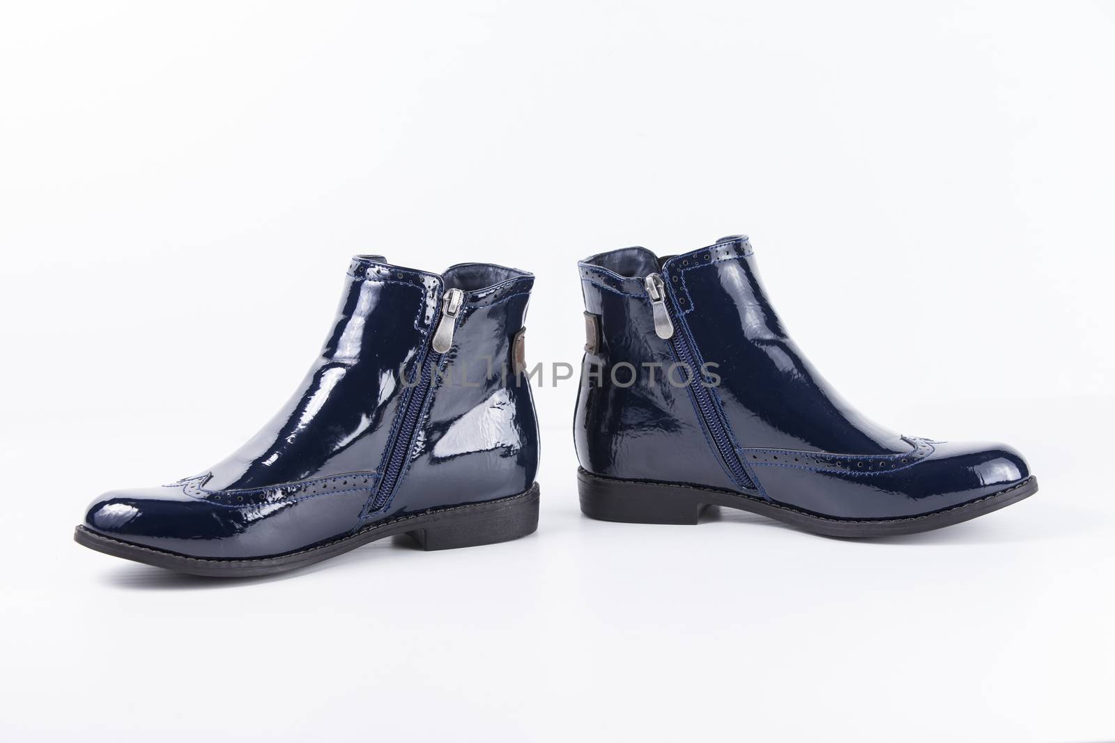 Pair of blue leather boots on white background, isolated product.