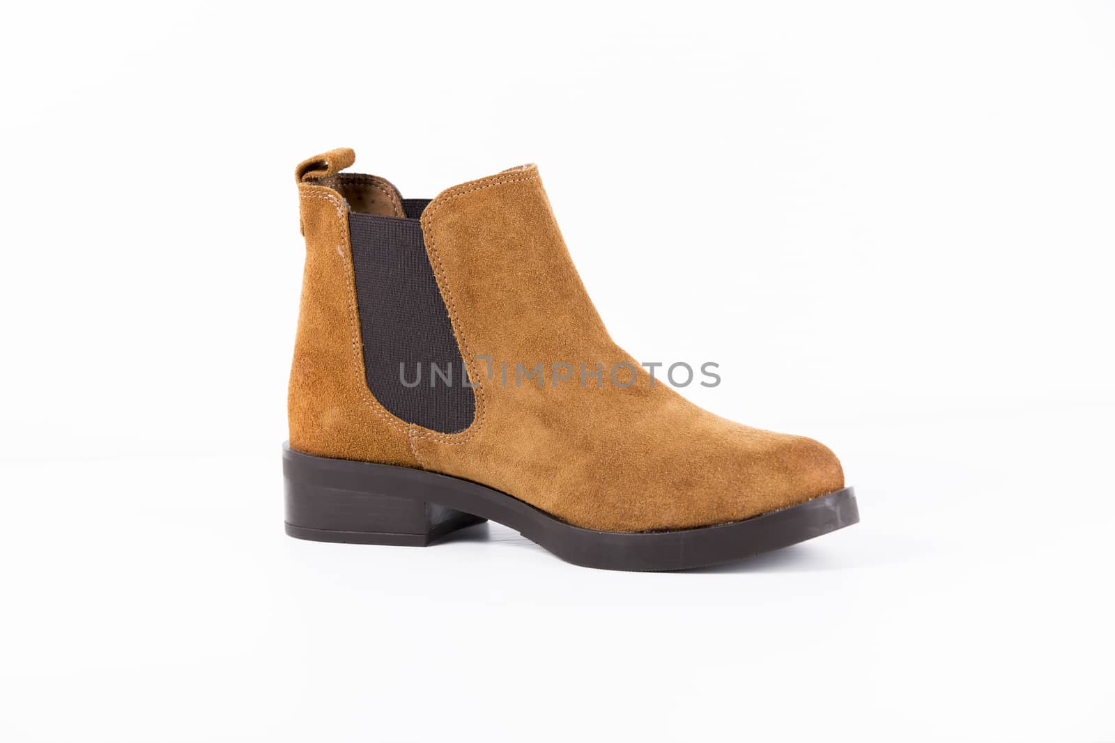Brown leather boot on white background, isolated product.