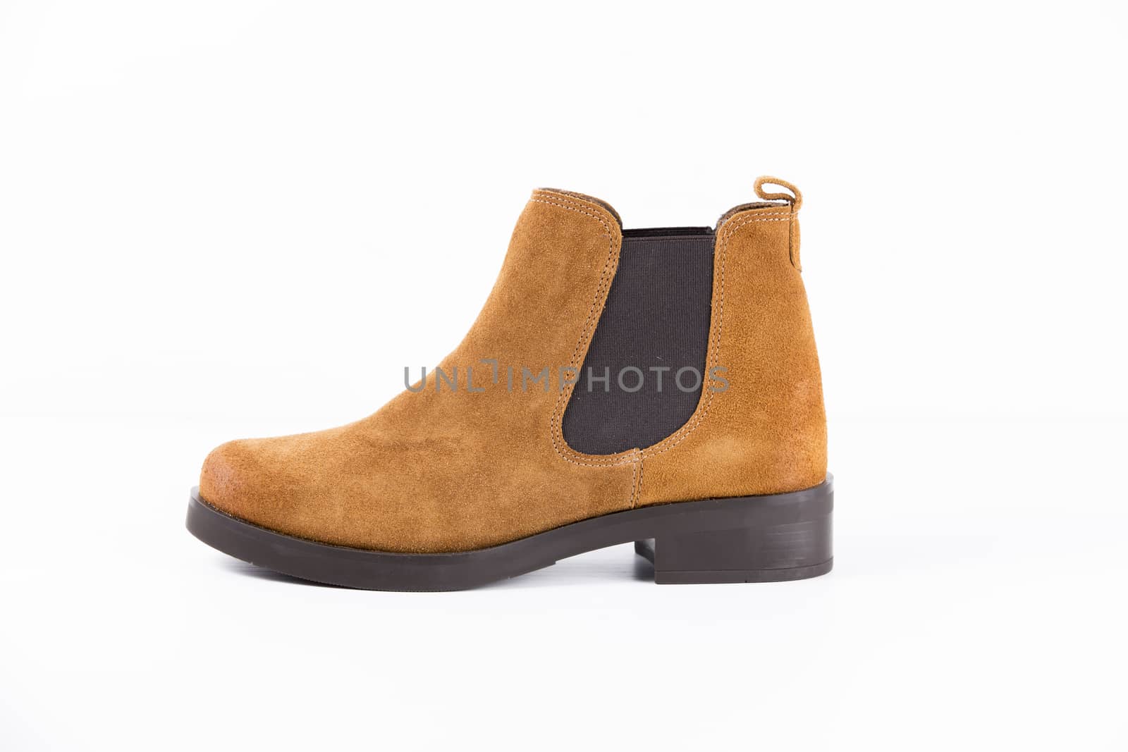 Brown leather boot on white background, isolated product.